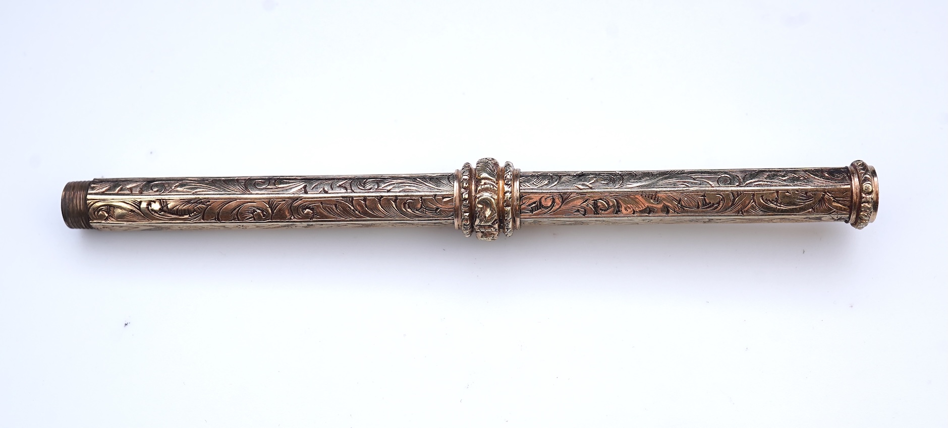 An early Victorian gold and amethyst mechanical pencil, mid 19th century